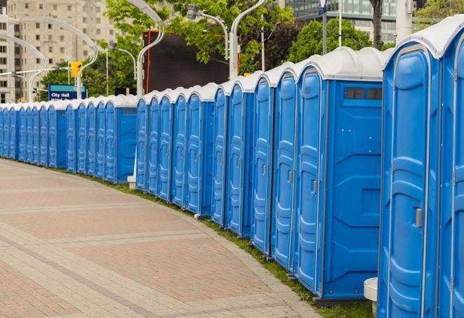 a row of portable restrooms at a fairground, offering visitors a clean and hassle-free experience in luttrell